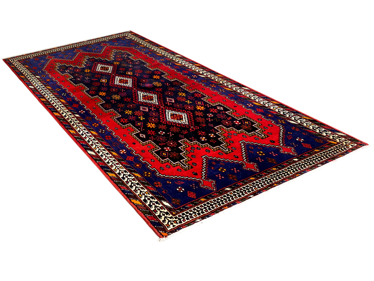 Sirjan-Läuferteppich mit geometrischem Rot-Blau-Muster und dekorativer Bordüre