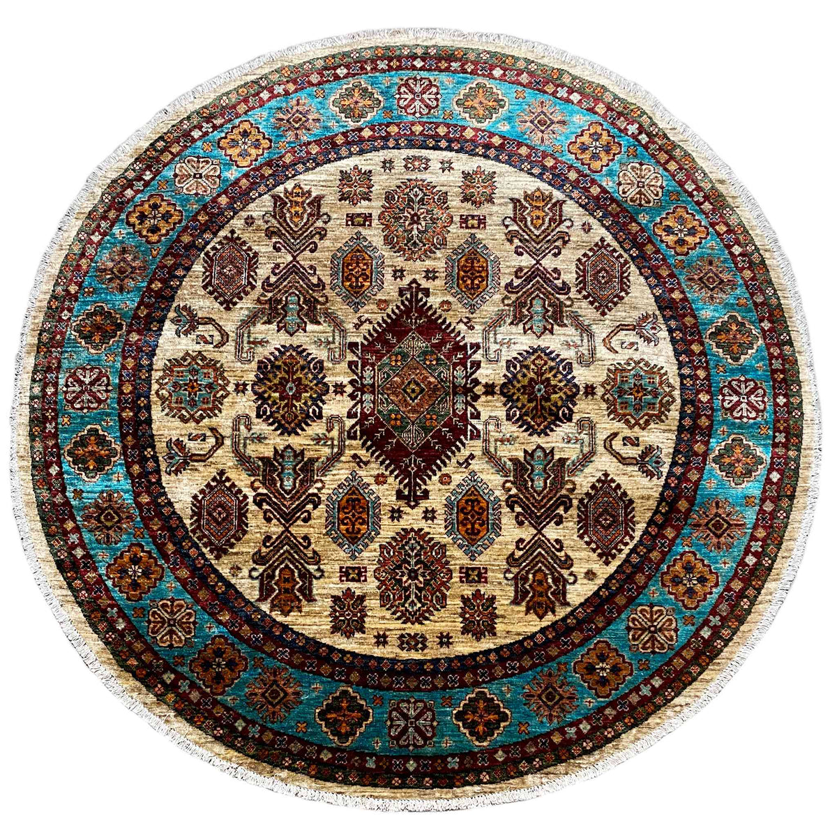Runder Teppich mit geometrischem Muster in Creme, Blau und Braun, mit Fransenrand