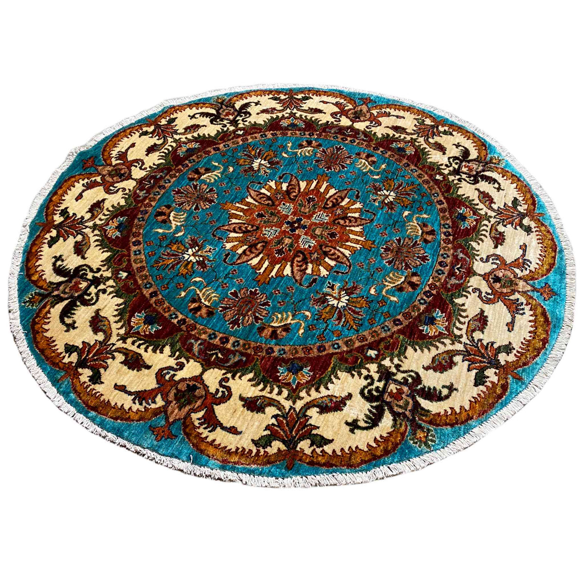Runder Barock-Teppich mit türkisfarbener Mittelfläche, braunen Mustern und beigem Rand.