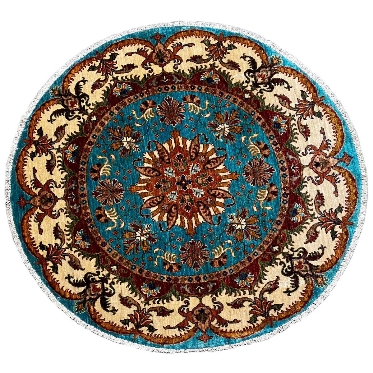 Runder Teppich mit türkisfarbenem Medaillon, braunem Ornament und beigem Hintergrund, floral.