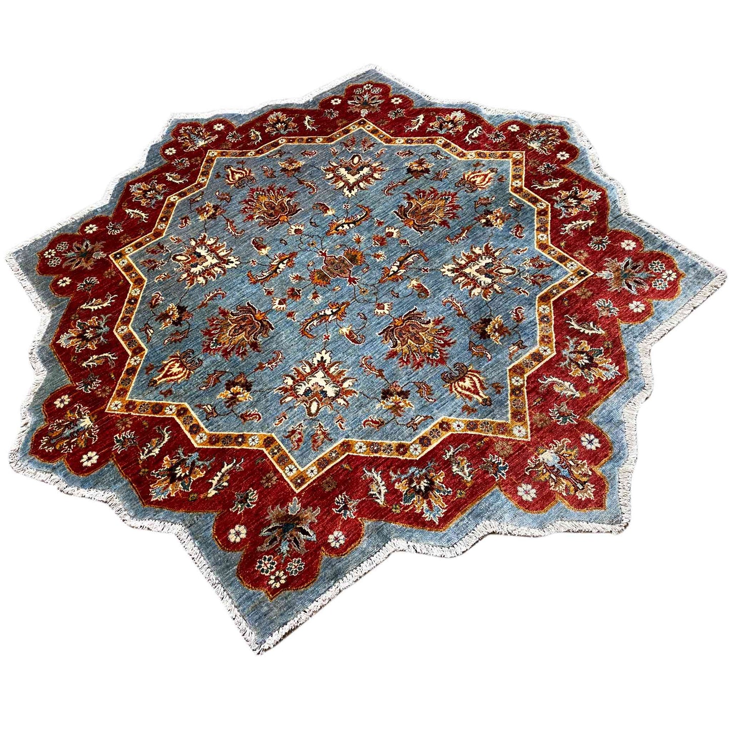 Sternförmiger Teppich mit blau-rotem Medaillon und floralen Mustern