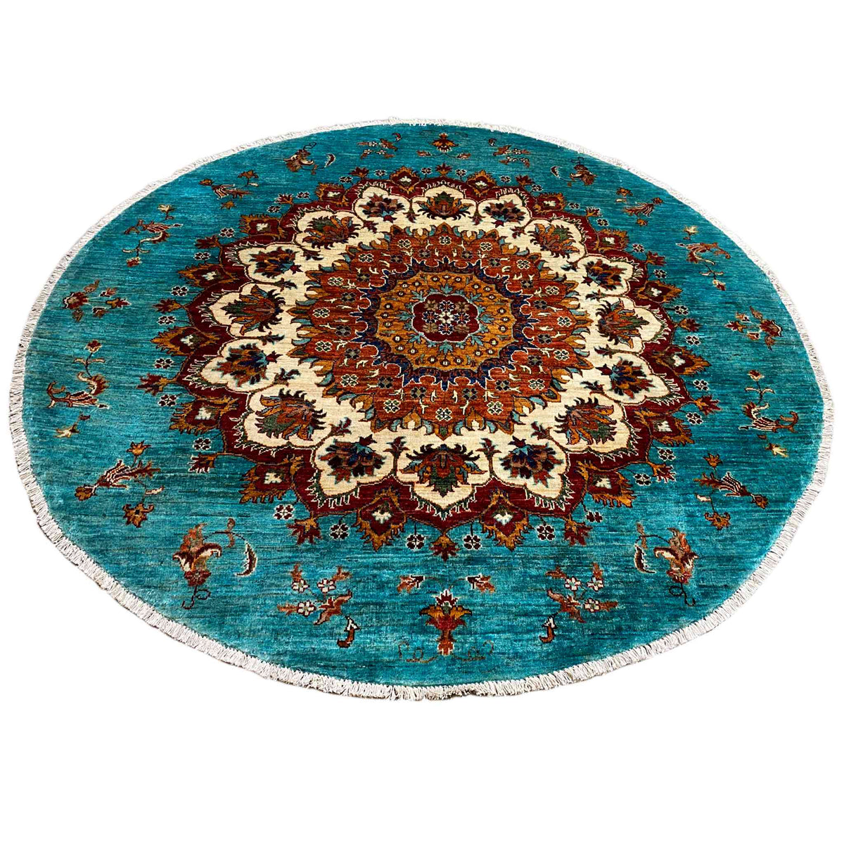 Khorjin-Teppich rund: türkiser Grund mit detaillierter Ornament-Vignette in Rot, Creme und Braun.