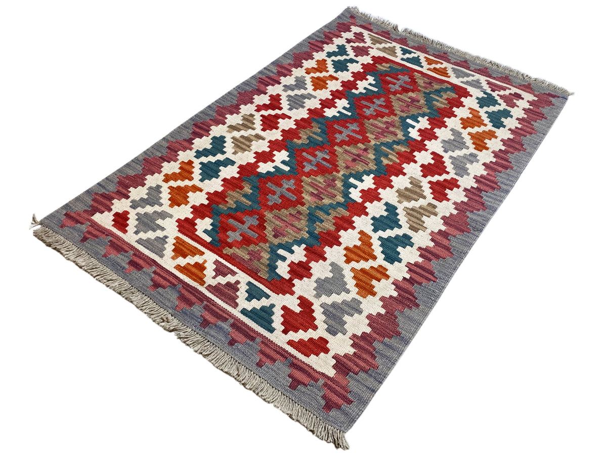 Rechteckiger Kelim Teppich mit geometrischem Muster in Rot, Blau, Grün und Beige