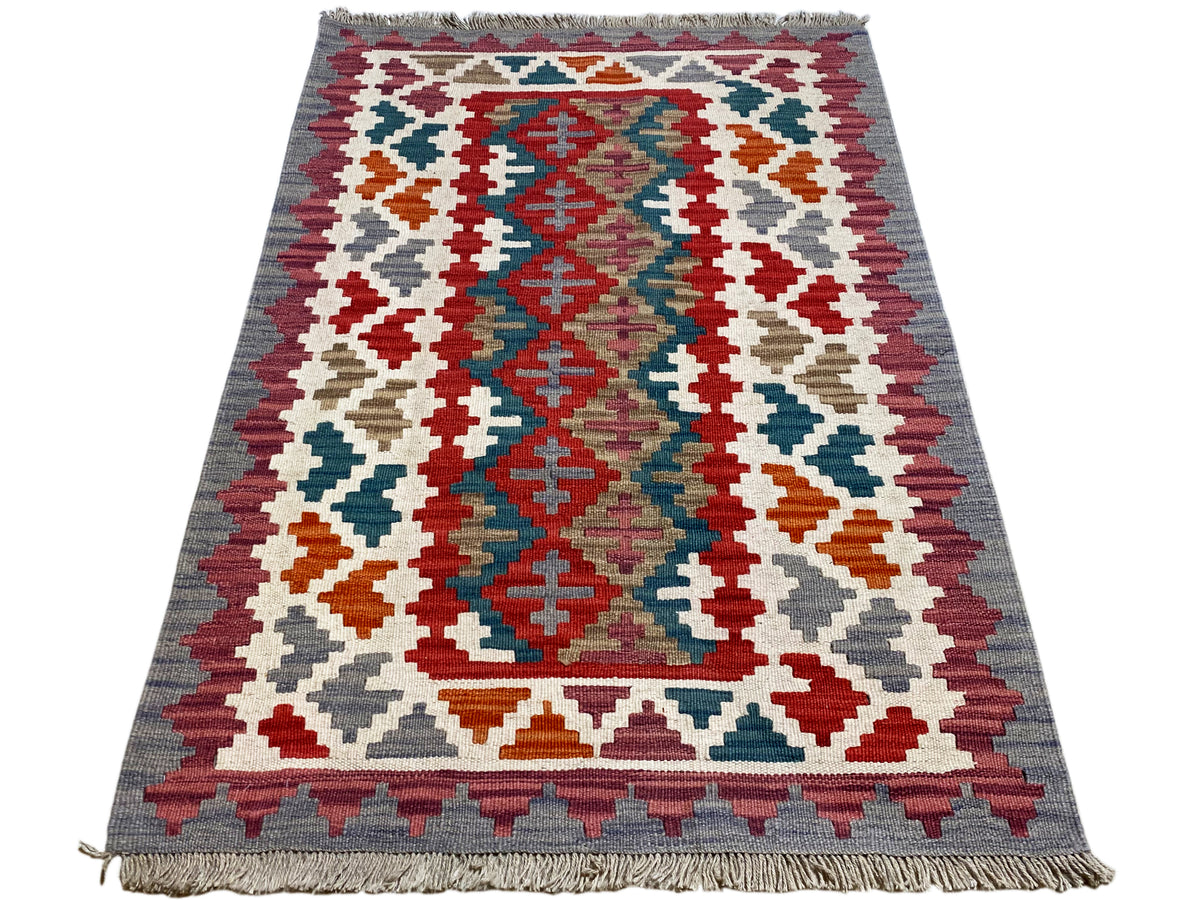 Rechteckiger Kelim Teppich mit großem geometrischem Muster in Rot, Blau, Grün und Weiß