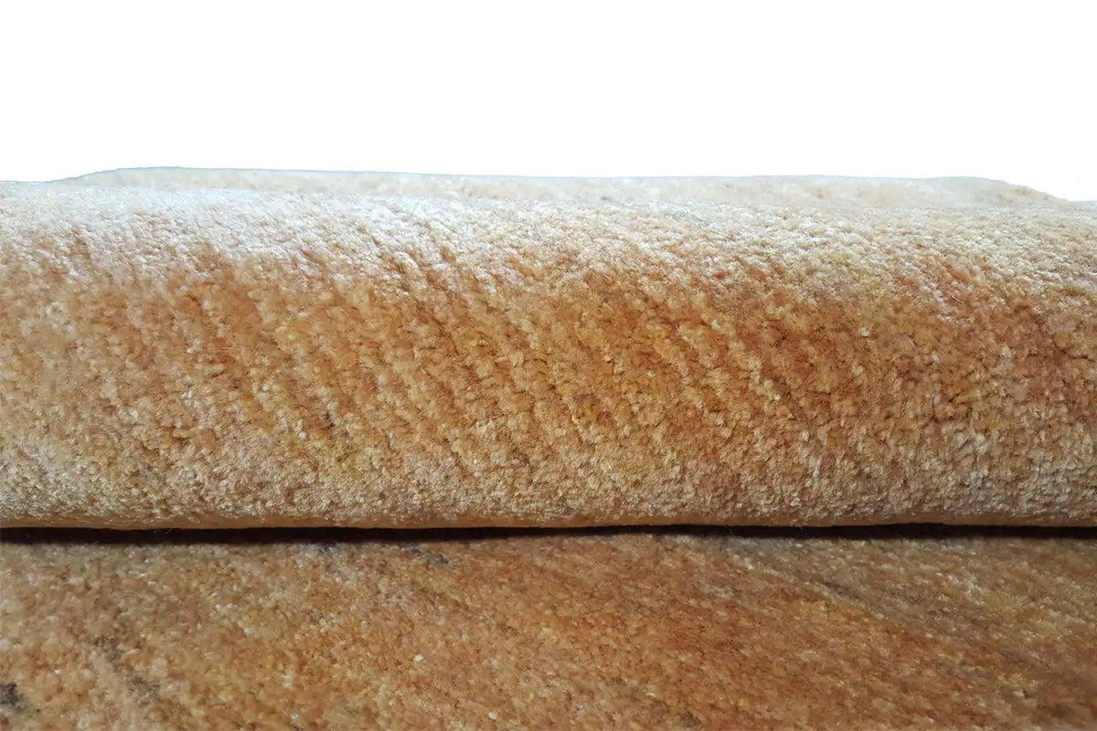 Gabbeh-Teppich Gold, Nahaufnahme vom Flor und Rand, braungoldene Textur
