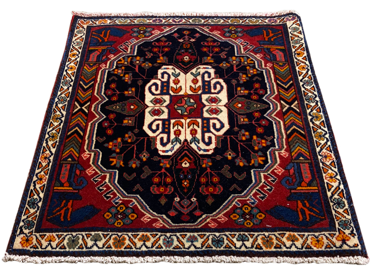 Poshti Teppich rechteckig mit blauem Hintergrund und symmetrischem Ornament-Muster