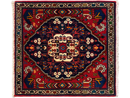 Teppich mit quadratischem Medaillon, blau-rotes Muster und cremefarbene Akzente, Fransenrand