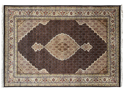 Handmade Indo Tabriz rug with central medallion design